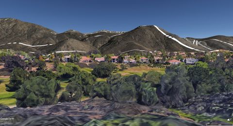 View from Orchard View Lane backyard looking southeast at proposed ridgeline lots - note proposed Safari Highlands Ranch Road